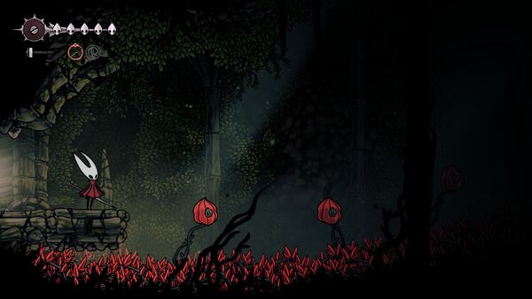 Une zone de sauts d'obstacles avec deux ronds rouges sur lesquels on rebondit dans Hollow Knight: Silksong