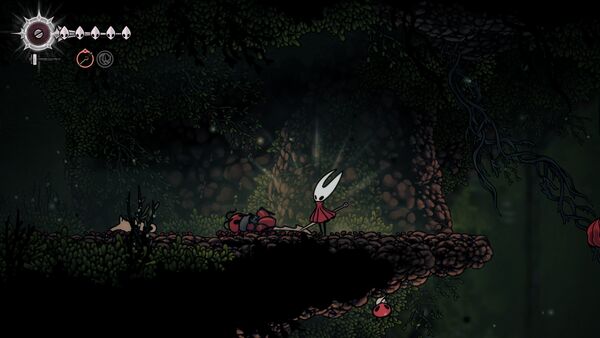 Les fourmis qui transportent un de leur combattant coupé en deux par Hornet dans Hollow Knight: Silksong